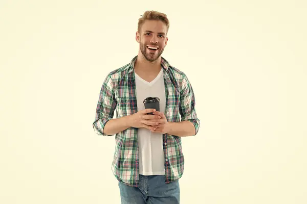 stock image photo of cheerful millennial man with coffee. millennial man with coffee isolated on white. millennial man with coffee on background. millennial man with coffee in studio.