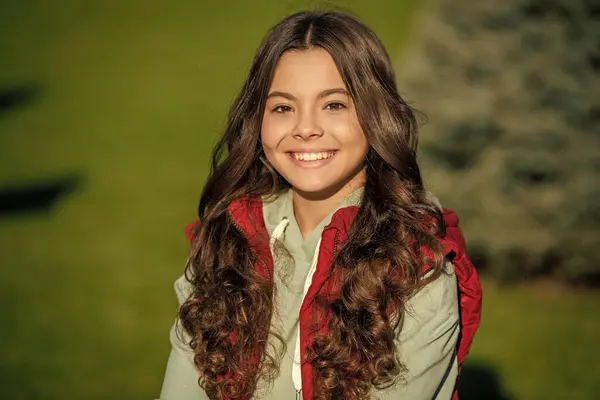 Stock image image of curly teen girl. curly teen girl outdoor. curly teen girl outside. curly teen girl portrait.