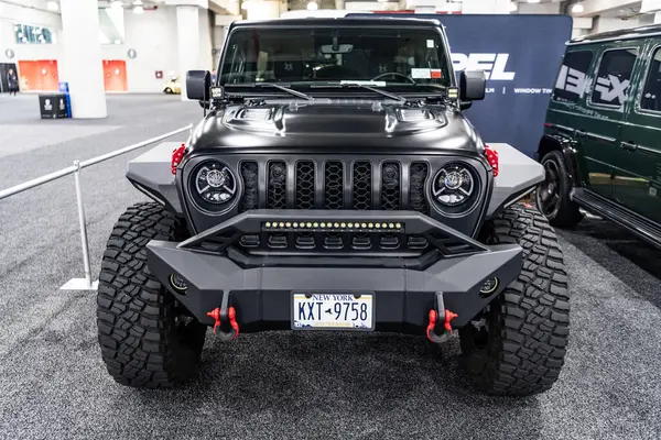 stock image New York City, USA - March 27, 2024: Jeep Wrangler JL Unlimited Sport car at New York International Auto Show, front view.