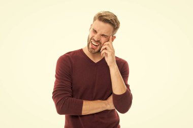 man with headache isolated on white. man with headache in studio. man with headache on background. photo of man with headache or migraine.