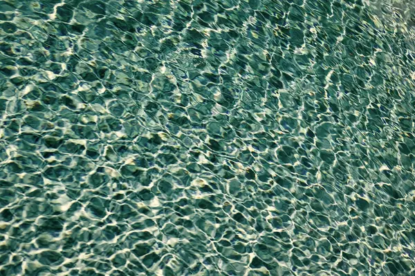 stock image rippled underwater backdrop blue color in summer swimming pool.