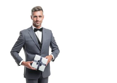 smiling mature man in suit with birthday present isolated on white.