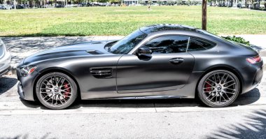 Miami Beach, Florida USA - April 15, 2021: matte mercedes benz v8 biturbo, side view high angle.
