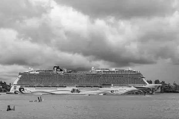 stock image New York, USA - July11, 2023: Cruise ship Norwegian Joy Sailing next to Manhattan in New York. Skyline of New York Manhattan cruising on the Hudson River cruise liner NCL.