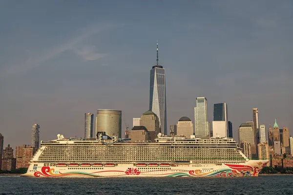 stock image New York, USA - June 13, 2023: Cruise ship Norwegian Joy Sailing next to Manhattan in New York. Skyline of New York Manhattan cruising on the Hudson River cruise liner NCL.