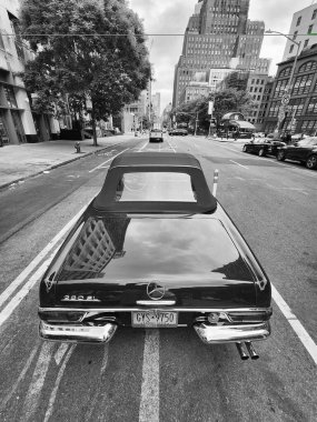 New York City, USA - June 03, 2023: Mercedes-Benz W113 two-door green metal top rear view in the street. clipart