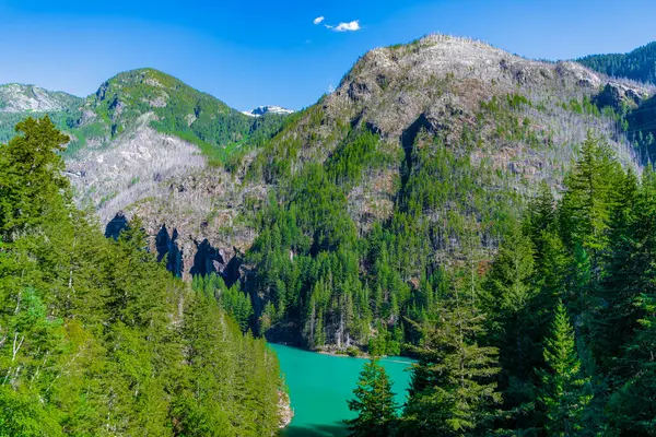 stock image Diablo lake with mountain landscape. Landscape of mountain peak and Diablo lake. Nature landscape. Diablo Lake in North Cascades National Park. Scenic nature view at Diablo lake. Traveling.