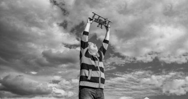 happy retirement. bearded granddad with toy. retired old man outdoor. senior man at retirement on sky background.