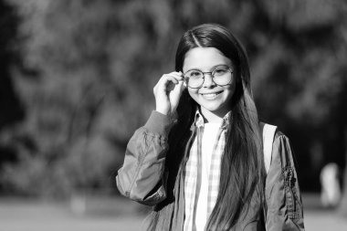 cheerful kid with backpack wear glasses. back to school.