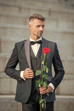 special occasion concept. elegant man with rose for special occasion. man at special occasion.