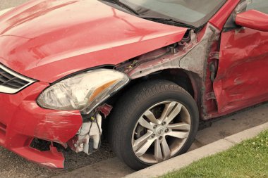 Seattle, Washington, USA - April 1, 2021: broken nissan car after road accident.