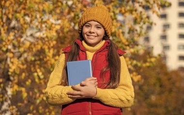 happy girl student back to school in autumn.