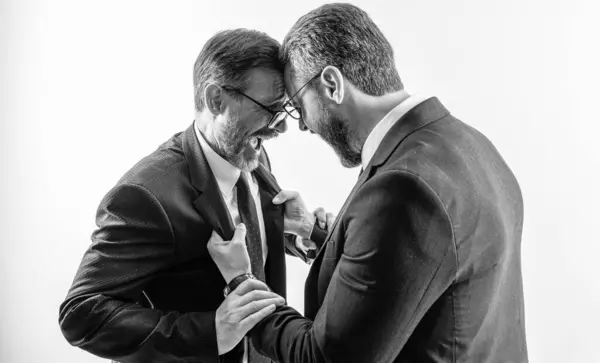 Stock image rival company threatening. businessmen threaten business men isolated on white. historic rivalry. businessmen threaten business model. men having conflict. threatening business reputation.