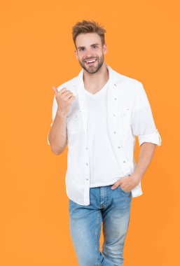 handsome man with stubble isolated on yellow. handsome man with stubble in studio. handsome man with stubble on background. photo of handsome man with stubble hair.