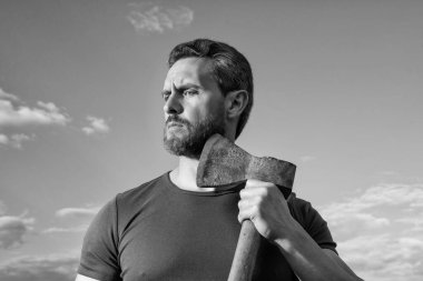 bearded man with axe. caucasian man hold ax. brutal man on sky background. clipart