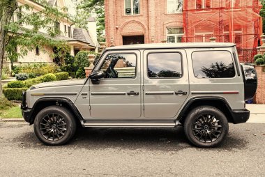 New York City, USA - August 26, 2023: 2021 Mercedes Benz G550 car also called G-Wagen off roader, side view. clipart