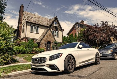 New York City, USA - August 26, 2023: 2019 Mercedes Benz AMG S63 convertible car, side view. clipart