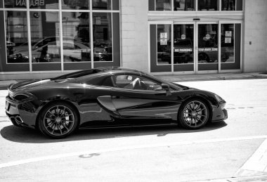 Miami Beach, Florida USA - April 15, 2021: mclaren exclusive 570GT MSO Black, side view.
