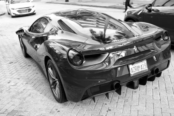 Miami Beach, Florida USA - April 18, 2021: luxury red Ferrari 488 GTB, back view.