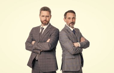 leadership of two businessmen isolated on white background. businessmen leadership concept. leadership of two businessmen in studio. image of leadership of businessmen wear suit.