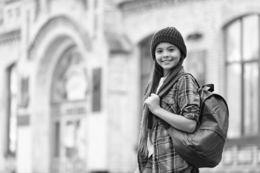 Happy tween girl back to school outdoors, copy space.