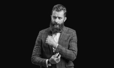 man in tuxedo menswear at studio. man in tuxedo menswear on background. photo of man in tuxedo menswear with beard. man in tuxedo menswear isolated on black.