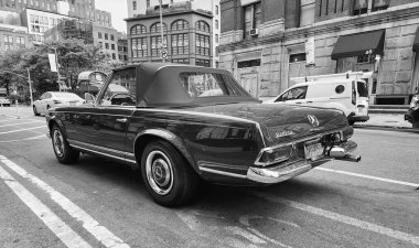 New York City, USA - June 03, 2023: Mercedes-Benz W113 two-door green metal driver side rear view in the street. clipart