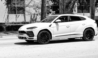 Miami Beach, Florida USA - April 15, 2021: 2019 Giallo Auge Lamborghini Urus, side view.