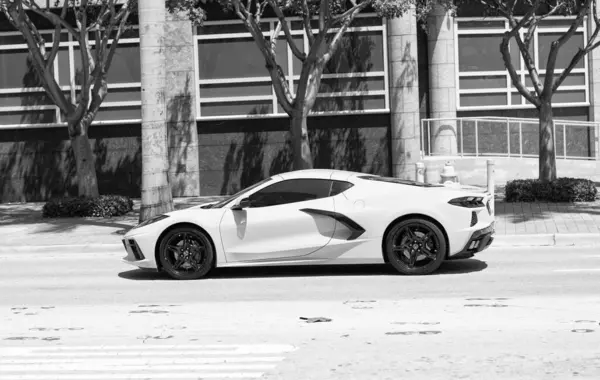 Miami Beach, Florida USA - April 15, 2021: white chevrolet corvette sportcar, side view.