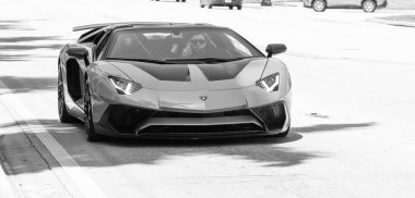 Miami Beach, Florida USA - April 15, 2021: orange Lamborghini Aventador LP 750-4 SV, front view.