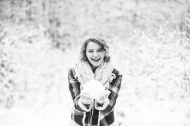 Exciting winter photoshoot ideas. Snowflakes are tiny crystals. Snow games. Winter outfit. Snow makes everything outdoors look amazing. Woman warm clothes snowy forest. Nature covered snow. Happiness.