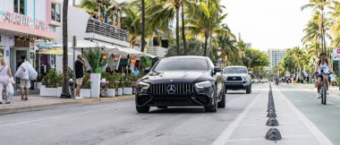 Miami Beach, Florida USA - June 6, 2024: 2020 Mercedes-Benz AMG GT 63 at miami beach ocean drive. black Mercedes-Benz AMG GT 63 clipart