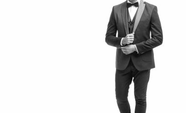 man bridegroom in rich tux bow isolated on white background. full lentgh.