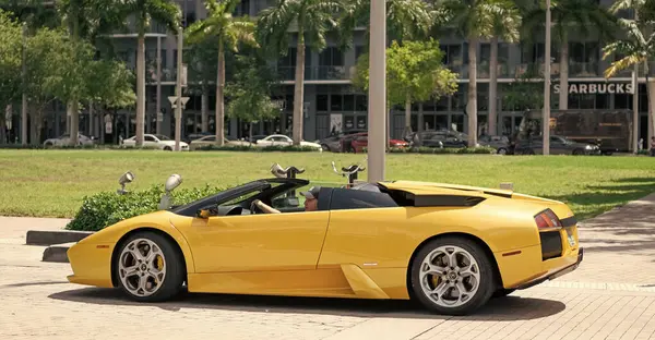 Miami Beach, Florida USA - April 15, 2021: yellow lamborghini diablo v12 6.2L, side view. convertible supercar.