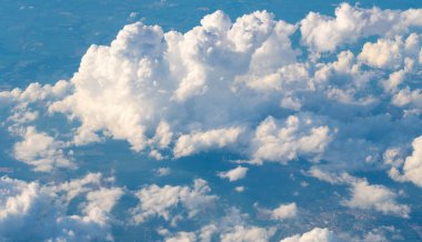 blue sky with a few clouds. The sky is very bright and the clouds are scattered throughout. Beautiful cloud in blue sky. White fluffy clouds in the sky clipart