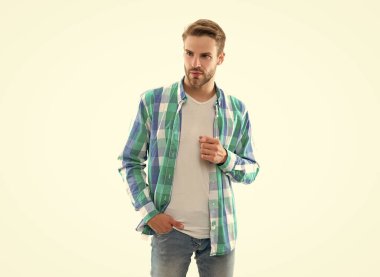 photo of stylish casual guy with stubble. casual guy isolated on white background. casual guy in studio. casual guy wearing checkered shirt.
