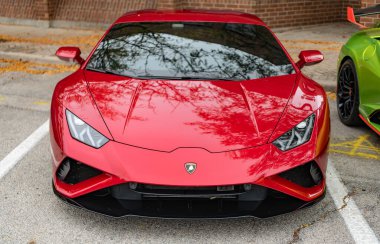 Chicago, Illinois - September 29, 2024: 2020 Lamborghini Huracan LP 640-4 EVO Spyder. Red 2020 Lamborghini Huracan LP 640-4 EVO Spyder parked on the street. Lamborghini is italian Luxury car clipart