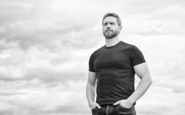 man in red shirt outdoor on sky background. copy space.