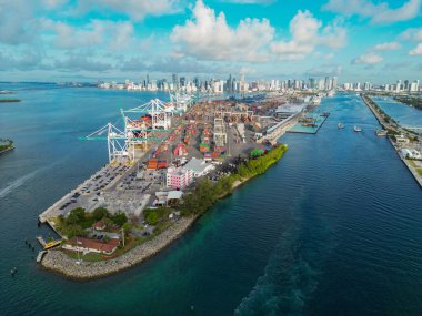 Miami, Florida, USA - June 07, 2024: Miami port aerial view. Panorama aerial drone view of Dodge island. Cargo Miami port with container. Port of Miami. clipart