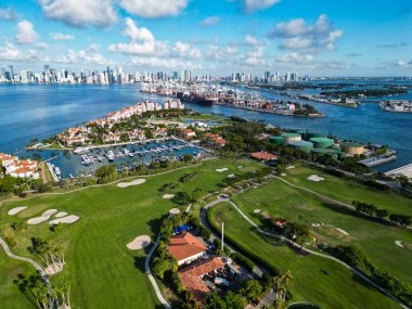 Miami, Florida, USA - June 07, 2024: Fisher island aerial view. Panorama aerial drone view of Fisher island, Miami. Miami beach from drone. Miami panorama, Florida. Panoramic view of Fisher island. clipart