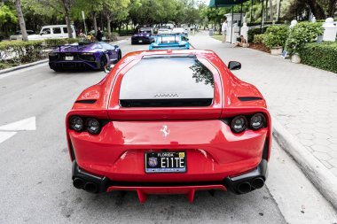 Miami Beach, Florida USA - June 9, 2024: 2019 Ferrari Portofino 812 superfast red in Miami beach. Ferrari is luxury italian brand. back view clipart