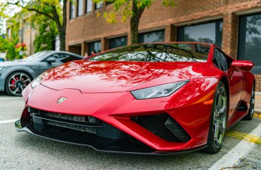 Chicago, Illinois - September 29, 2024: 2020 Lamborghini Huracan LP 640-4 EVO Spyder. Red 2020 Lamborghini Huracan LP 640-4 EVO Spyder parked on the street. Lamborghini is italian Luxury car clipart