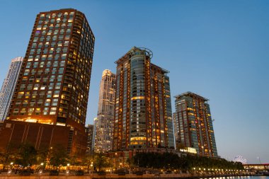 Night cityscape of Chicago skyscraper building. Chicago architecture of skyscraper. City night illuminated building. Skyscraper cityscape. Night city of Chicago. Business city. clipart