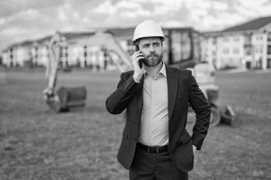 business man architect at break. business man architect outdoor. photo of business man architect at site. business man architect with phone. clipart