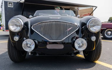 Chicago, Illinois, USA - September 08, 2024: 1956 Austin Healey 100 retro convertible sportscar vehicle, front view. Retro sportscar. Convertible Austin Healey car. Austin Healey car clipart