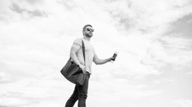 Man traveller travelling on vacation sky background, copy space.