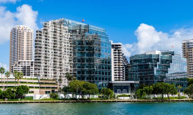 Modern glass building. Skyscraper in business city. City downtown with skyscraper. Office building in city district. Brickell Key. Skyscraper building architecture. Skyscraper with glassy exterior. clipart