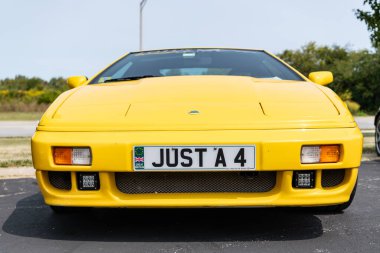 Chicago, Illinois, USA - September 08, 2024: Lotus Esprit S4S model 1995 retro sportscar, corner view. Retro yellow car. Lotus Esprit S4S vehicle Lotus at Chicago clipart