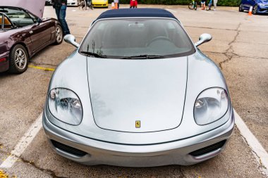 Chicago, Illinois - September 29, 2024: Ferrari 360 Spider modena. Ferrari 360 Spider modena parked on the street grey color clipart