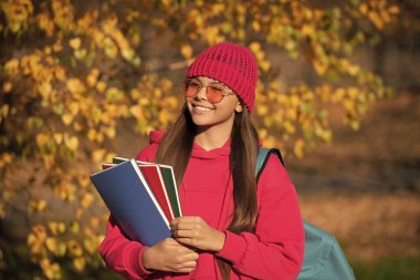 school education of teen girl. knowledge day on september. autumn september is schooling time. september 1. teen girl with school homework. girl enjoy fall outdoor. back to school. Lifelong learning. clipart